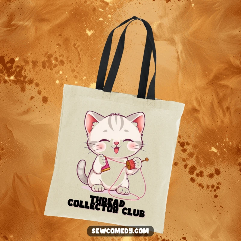 Funny kitten tote bag showing a playful cat batting a needle, perfect for crafters and cat lovers.
